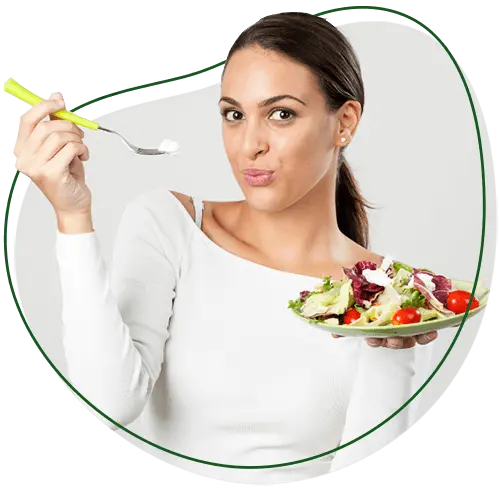 Chiropractic Weight Loss Program, What will I have to eat section image. Woman facing a camera, holding a dish containing salad with one hand. Her other hand is raised, and she is holding a fork in it.
