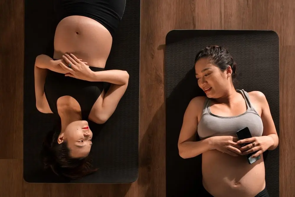 Pregnant women practicing yoga together