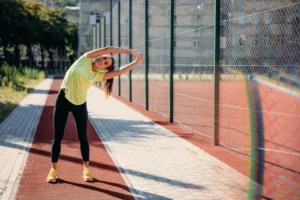 Pickleball player warming up with stretches before a game