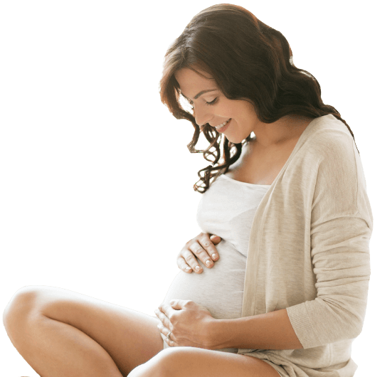 Gateway to Wellness Pregnancy Chiro Banner image overlay. Pregnant person sitting down and looking at belly while holding it and smiling.