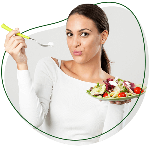 Chiropractic Weight Loss Program, What will I have to eat section image. Woman facing a camera, holding a dish containing salad with one hand. Her other hand is raised, and she is holding a fork in it.