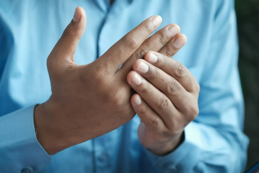 Close-up image of hands using medical or chiropractic tools